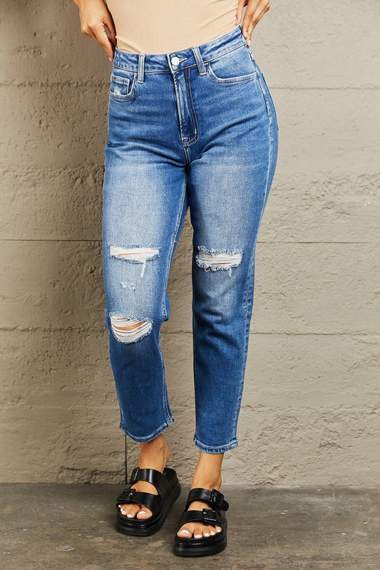 These jeans effortlessly combine the trendy "dad" fit with a modern touch, featuring a flattering high-rise waist and a cropped length for a chic and edgy look. Crafted from premium quality dark-wash denim, they are both durable and stretchy, ensuring all-day comfort.