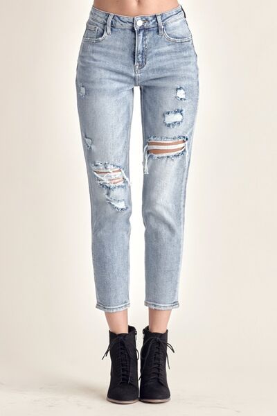 The cropped length adds a modern and stylish twist, making them versatile for various outfit combinations. Made from high-quality denim, they offer both comfort and durability. These jeans can be easily dressed up with heels or dressed down with sneakers for any occasion. Whether you're going for a casual day look or a night out with friends, these distressed slim cropped jeans will effortlessly elevate your style.