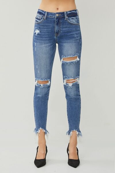 These Distressed Frayed Hem Slim Jeans are a must-have for anyone who loves a touch of edginess in their wardrobe. The distressed detailing adds a cool and rebellious vibe to these jeans, giving them a unique and trendy look. The slim fit design hugs your curves in all the right places, creating a flattering and stylish silhouette.