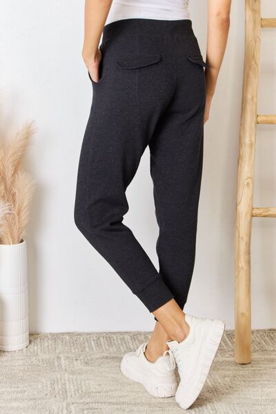 These joggers offer unparalleled comfort for lounging at home or running errands in style. The relaxed, yet tailored fit ensures maximum comfort without compromising on looks, while the elastic waistband provides a customizable fit for all-day wear. S - XL