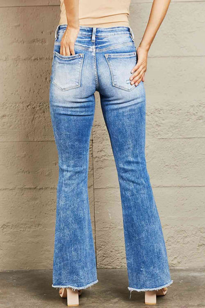 These jeans offer a flattering fit that hugs your curves while providing all-day comfort. The distressed detailing on the knee adds a touch of edginess to your look, while the raw cut hem lends a trendy and contemporary vibe. 