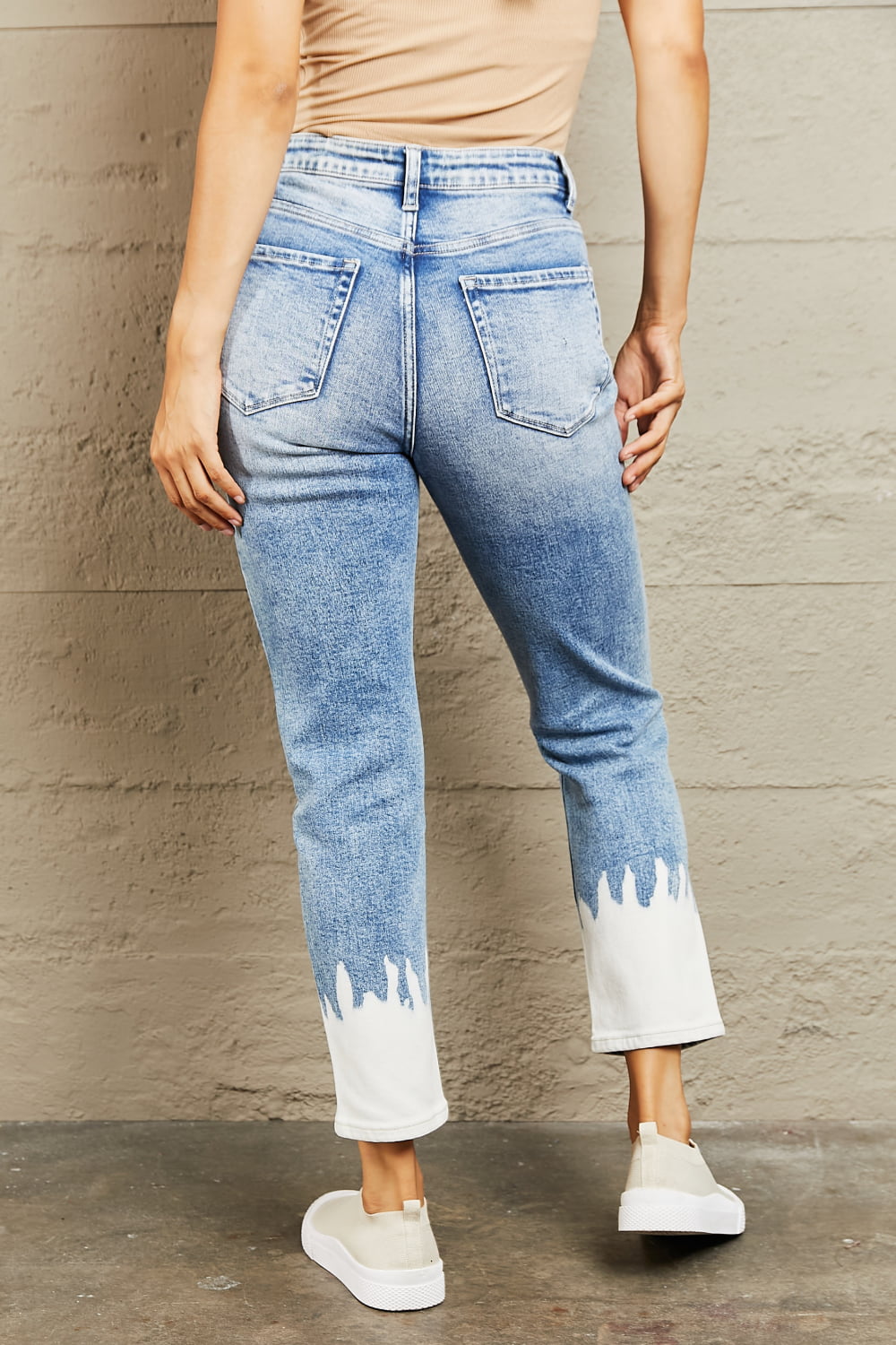 These jeans are the perfect blend of fashion and comfort, featuring a flattering high waist design that accentuates your curves while providing a comfortable fit. The medium wash adds a touch of vintage charm, while the distressed detailing gives them a chic and edgy look. 