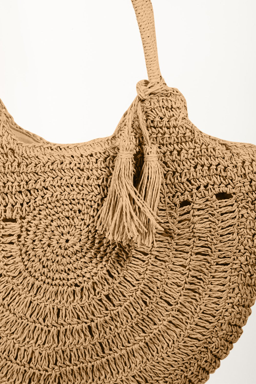 Straw Braided Tote Bag with Tassel is a charming and fashionable accessory that combines the natural texture of straw with a playful tassel detail. The braided design adds a touch of bohemian flair, perfect for summer days or beach outings. The tassel embellishment adds a fun and whimsical element to the overall look. 