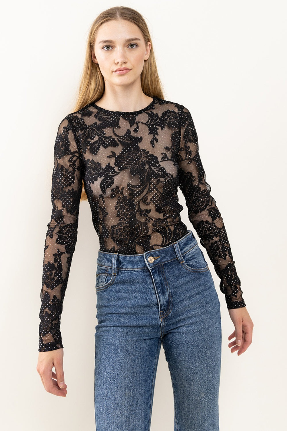 The Floral Lace Mesh Bodysuit features delicate lace detailing and a flattering mesh fabric. The intricate floral design adds a touch of femininity and elegance to any outfit. Perfect for a night out or a special occasion, this bodysuit offers a stylish look. S - L