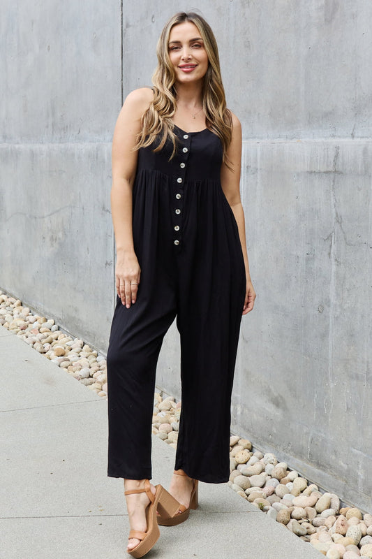 This jumpsuit is designed to be your go-to outfit for any occasion, whether you're running errands, attending a casual gathering, or simply lounging at home. This jumpsuit features a wide leg silhouette that not only offers a chic and contemporary look but also allows for unrestricted movement.