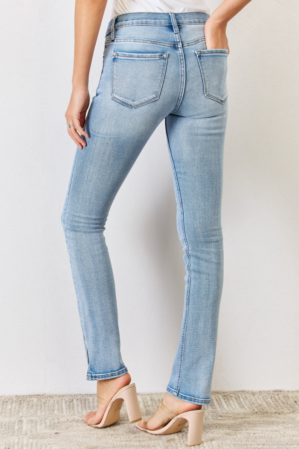 These jeans offer both style and comfort, hugging your curves while ensuring freedom of movement. The sleek side slit detail adds a modern twist, elevating the classic bootcut silhouette. Featuring a chic zip fly and a regular hem, these jeans exude sophistication. 1-20W