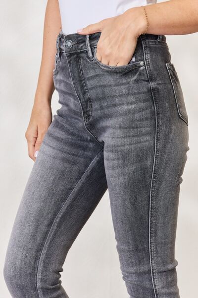 These jeans boast a high-waisted design that offers a flattering silhouette while providing remarkable tummy control. The release hem detail adds an edgy touch, elevating these skinnies from classic to chic. Made from premium stretch fabric, they ensure a comfortable fit while maintaining their shape wear after wear. Sizes 0/24 to 24W.