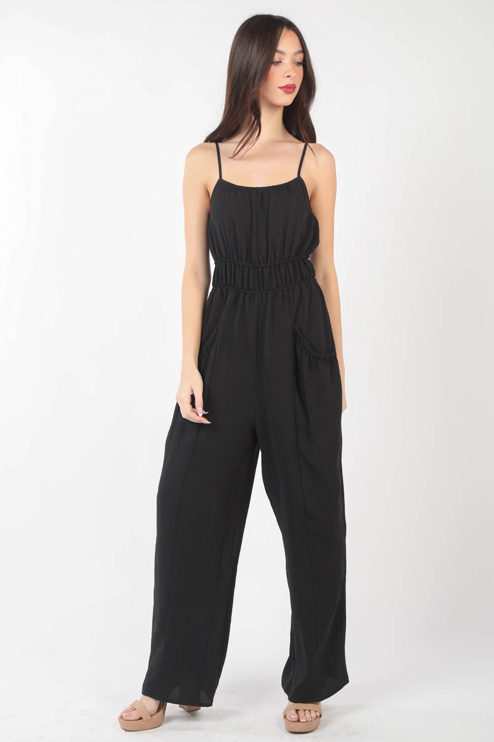 This Pintuck Detail Woven Sleeveless Jumpsuit is a chic and versatile piece for your wardrobe. The pintuck detailing adds a touch of sophistication to the sleeveless jumpsuit silhouette. Made from woven fabric, this jumpsuit offers a sleek and polished look.S - L