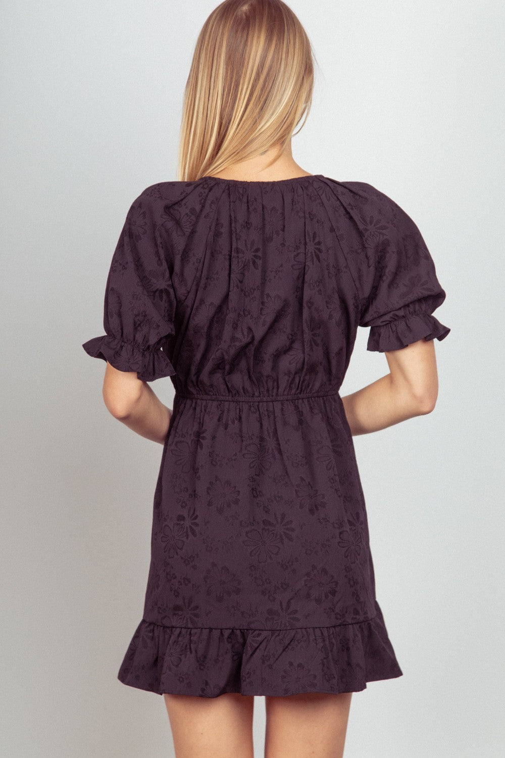 This Floral Textured Woven Ruffled Mini Dress is a charming and feminine choice for any special occasion. The floral textured fabric adds a romantic touch to the sweet ruffled details.  S - L