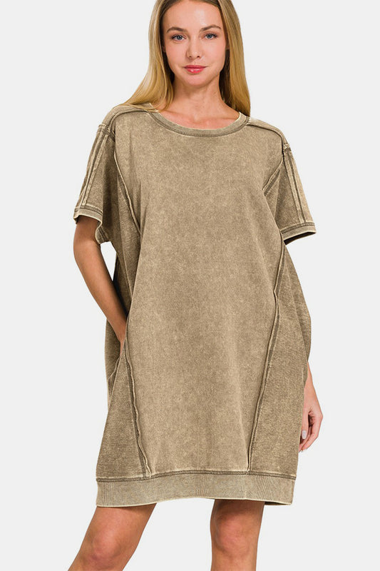 Add a touch of edge to your wardrobe with this washed exposed seam mini tee dress, a cool and casual piece that combines style and comfort. The washed effect gives the dress a laid-back and vintage vibe, perfect for a relaxed and effortless look. This dress features exposed seams and a unique and raw detail that sets it apart from traditional t-shirt dresses. s/m-l/xl