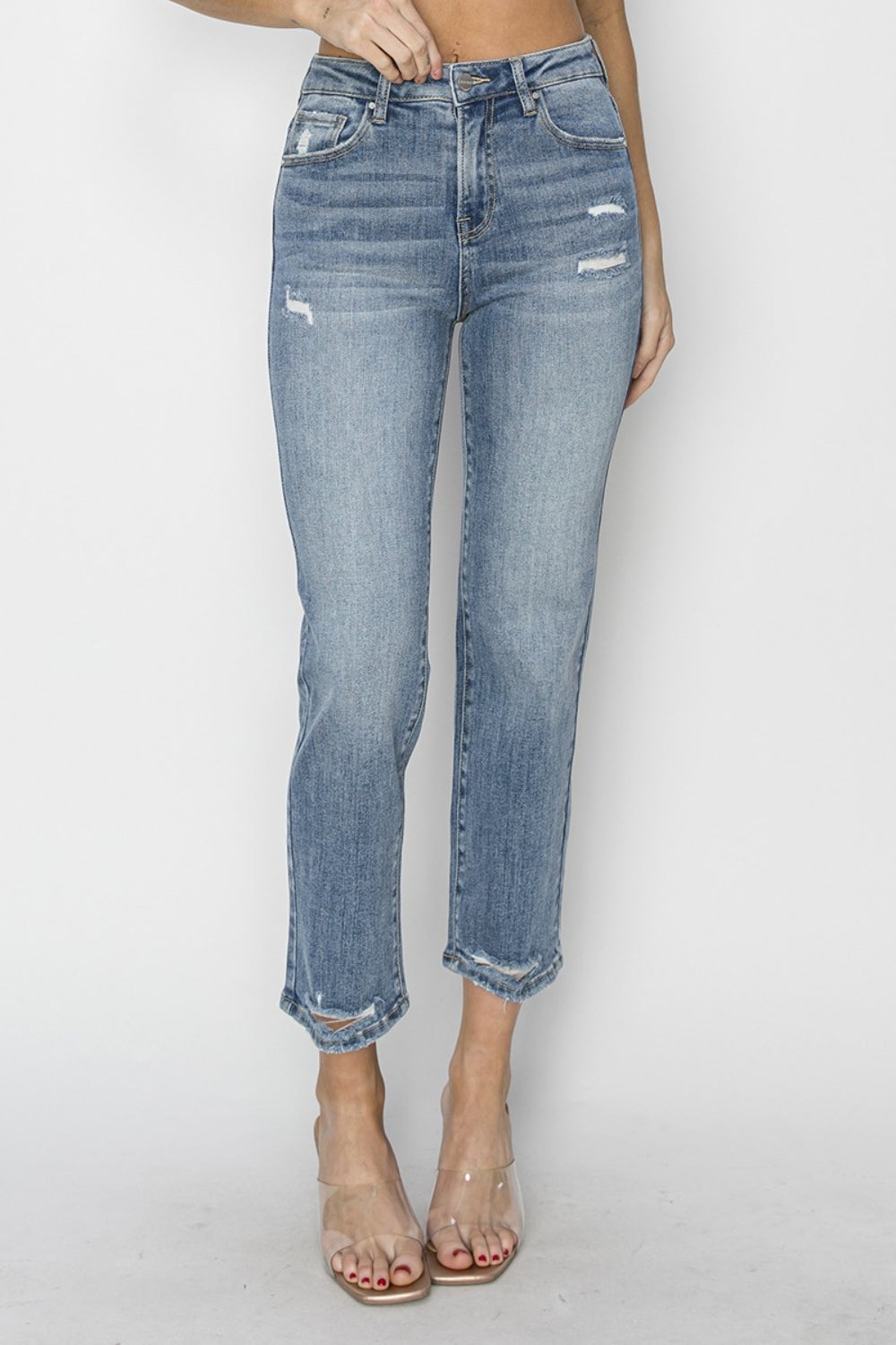 The High Waist Distressed Cropped Jeans are a trendy and edgy addition to your denim collection. The high waist design offers a flattering and on-trend silhouette. The distressed detailing adds a cool and rugged vibe to the cropped jeans. 