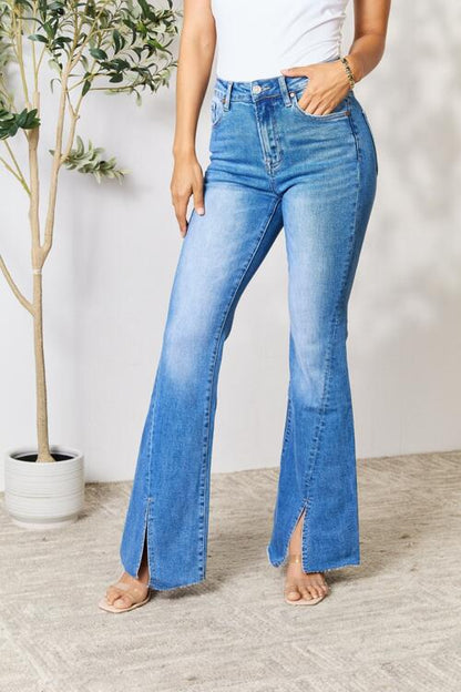 These jeans are a unique and stylish choice, featuring a flattering flared silhouette and eye-catching front slits that add a touch of intrigue. Perfect for making a statement, these jeans can be dressed up or down for any occasion.