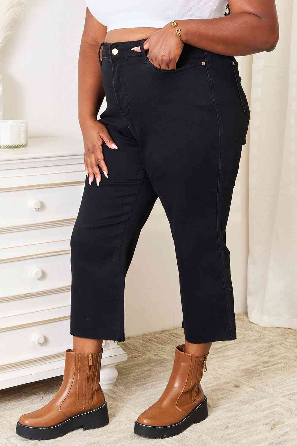 These jeans are a must-have addition to your wardrobe, offering a sleek and sophisticated look with their high waisted design that accentuates your curves. The cropped wide leg adds a touch of flair and versatility, allowing you to pair them effortlessly with both casual and formal outfits. What sets these jeans apart is their clean, no-distressing finish, making them a chic choice for any occasion.