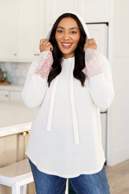 Stay cozy and cute with our A Tad Chilly Waffle Knit Hoodie. Made with soft and lightweight waffle knit, this hoodie features playful floral accents, a cozy hood, and a unique scooped hem. Plus, keep your hands warm with the trendy thumb holes. Perfect for chilly days! S - 3X