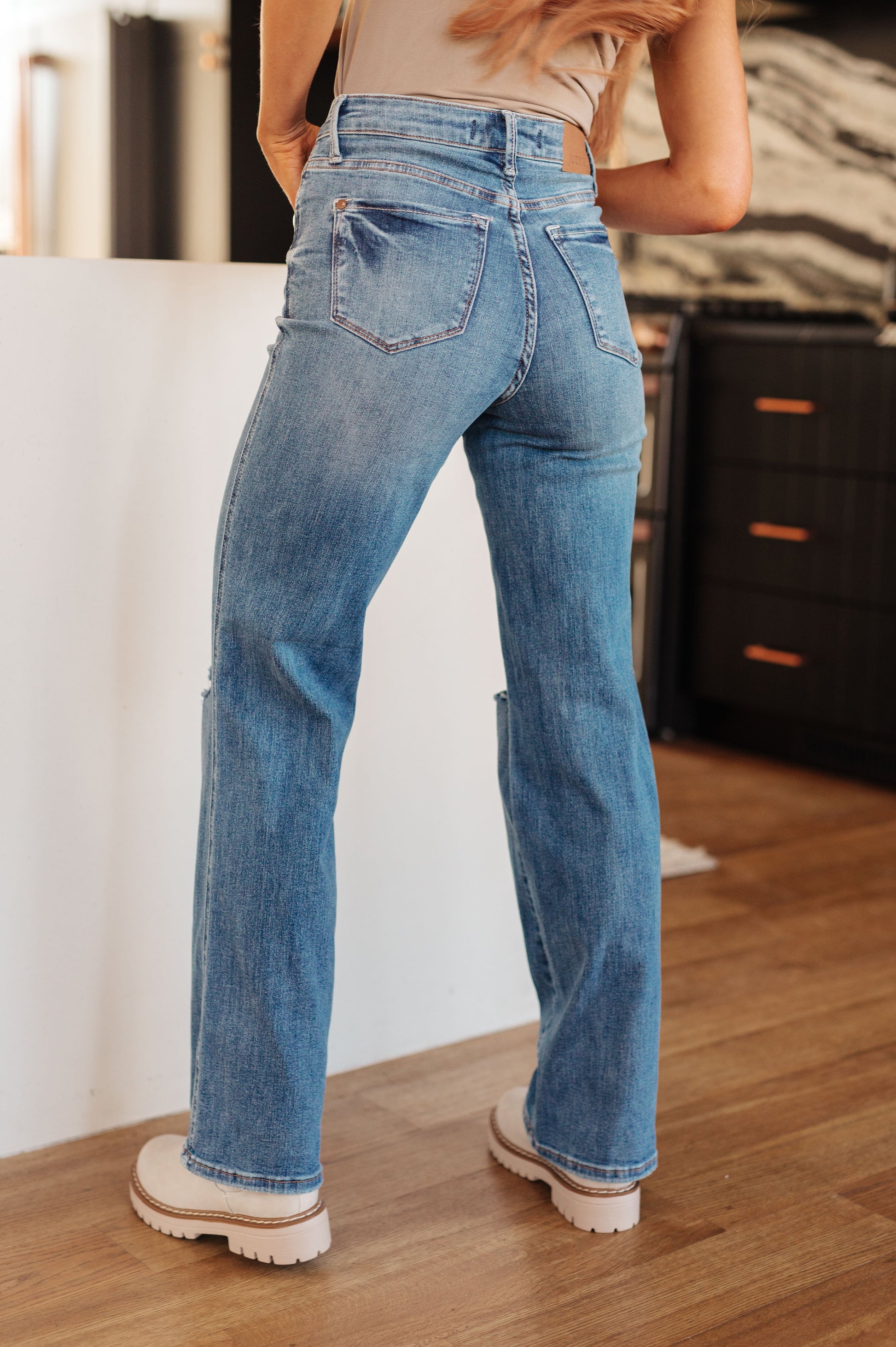 Introducing the Bree High Rise Control Top Distressed Straight Jeans from Judy Blue - the perfect blend of fashion and function. With a flattering high rise and tummy control technology, these jeans will give you a confidence boost. The distressed details and medium wash add an edgy touch to the classic straight silhouette.  0 -24W
