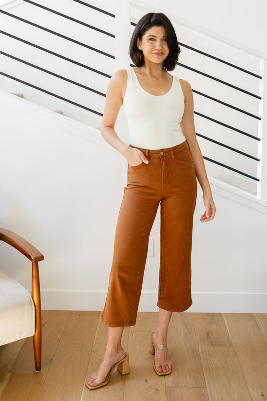 Discover your new favorite jeans with Briar's High Rise Control Top Wide Leg Crop Jeans from Judy Blue. Our triple threat of design, fit, and color come together for maximum style, comfort, and chicness. Features include high rise, tummy control tech, and a wide leg crop in a warm rich garment-dyed camel. Complete with coordinating hardware and you're ready to look and feel amazing! 0 -24W