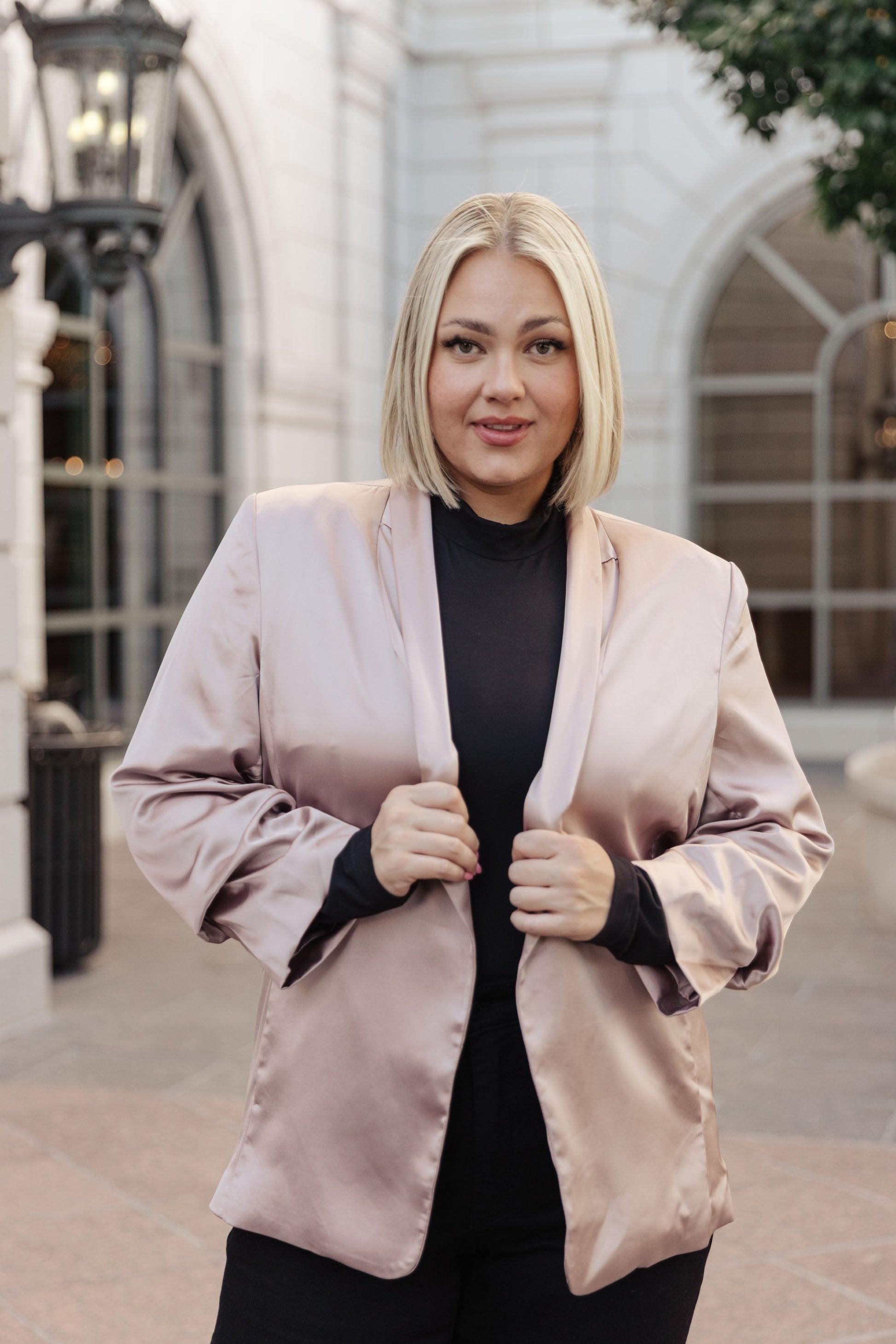 Transform your look into a sophisticated statement with the Champagne and Roses Satin Blazer. Crafted from silky poly satin with shawl collar, shoulder pads, ruched sleeves, open front, and side seam pockets, this essential blazer will complete your stylish ensembles with unique sophistication. Style it with the matching shorts for a head-turning, chic look. S - 3X