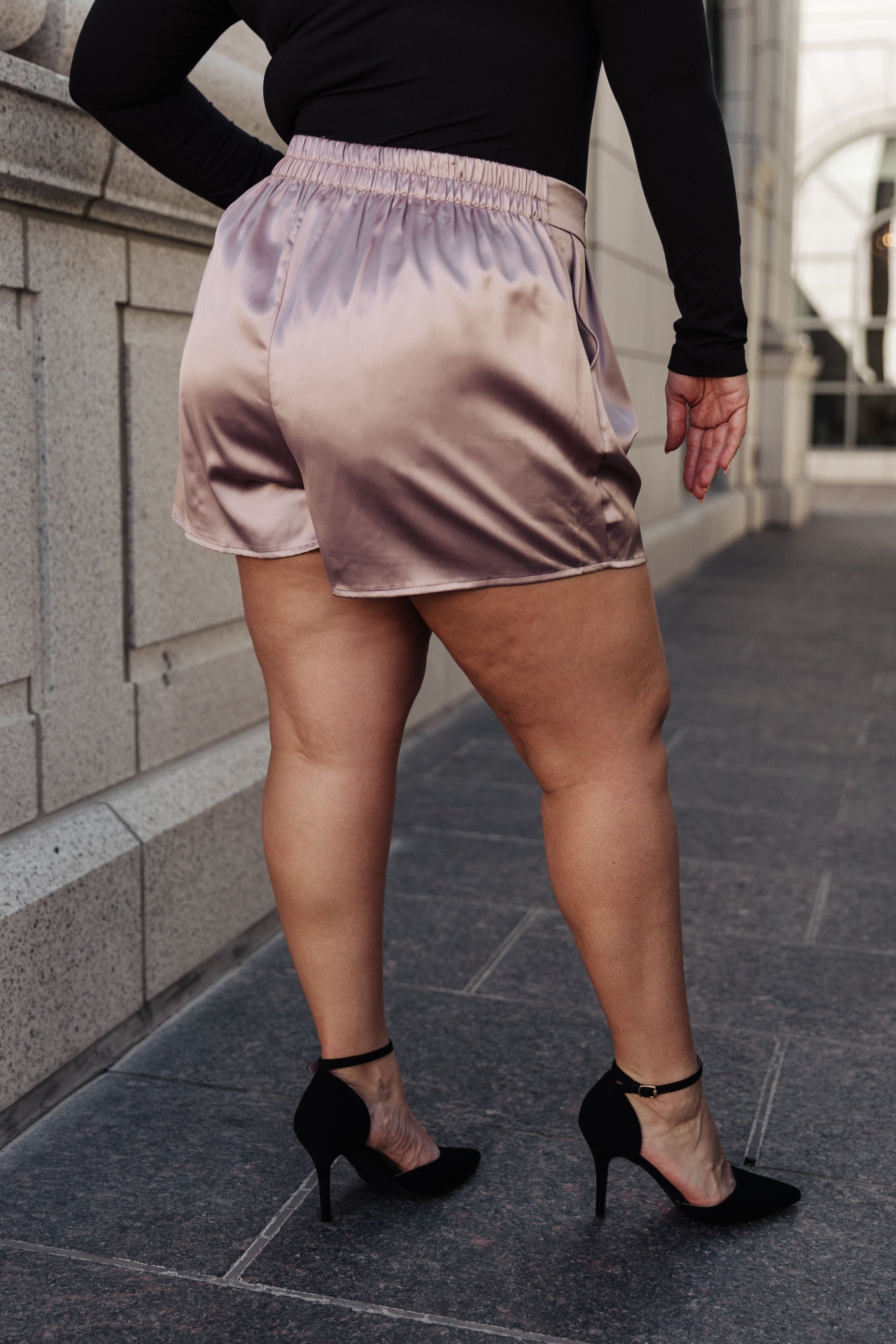 These chic Champagne and Roses Satin Shorts are perfect for making a statement. Crafted from a silky-smooth poly-satin, they feature a flattering flat-front design, pleated details, an elastic back waistband, and side pockets. Pair perfectly with the Champagne and Roses Satin Blazer for a complete look. S - 3X