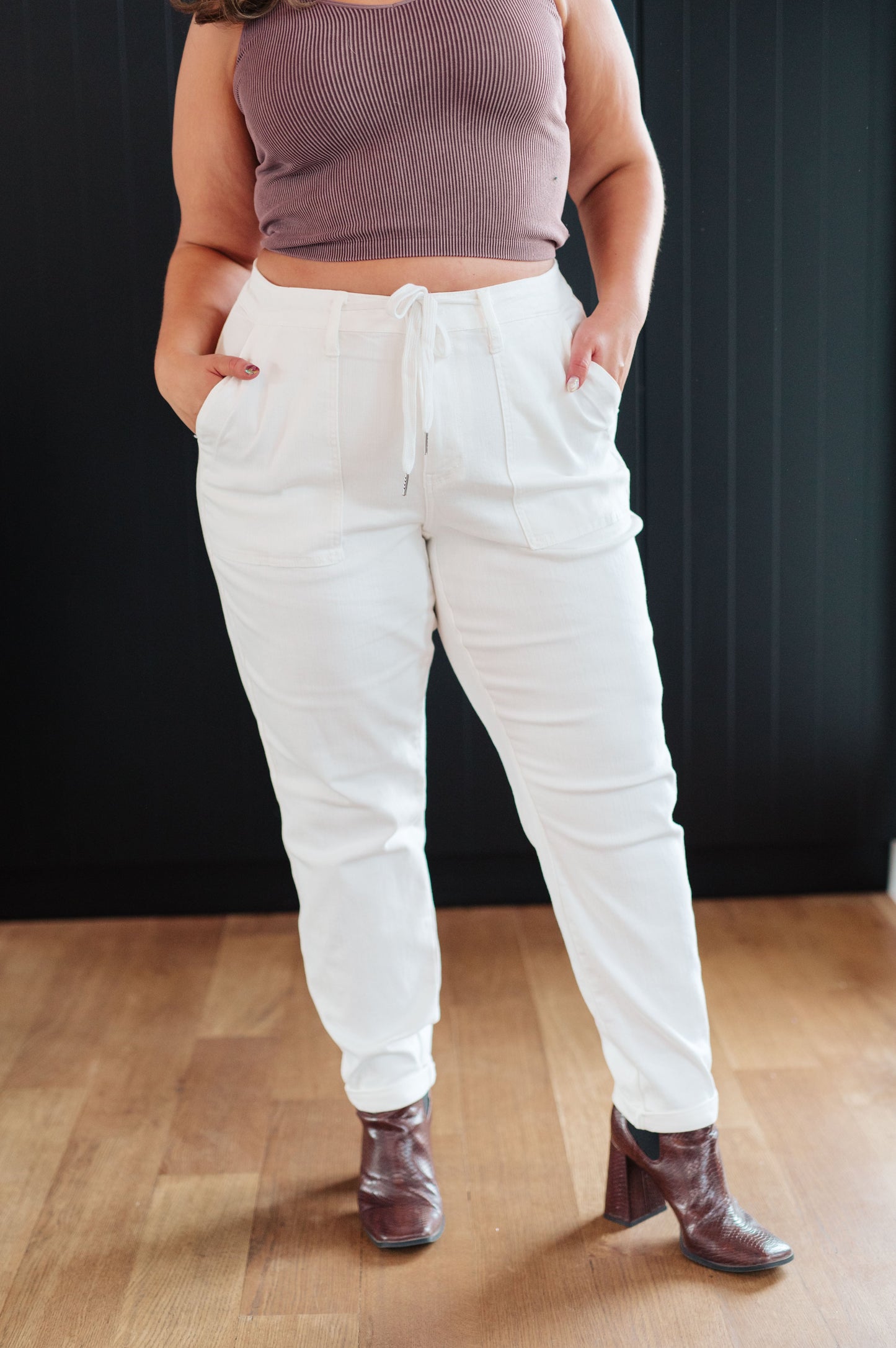 Take your laid-back look up a notch with the Charlene High Rise Jogger from Judy Blue. These versatile jeans highlights a high rise, perfect ecru color, and a drawstring waistband for a comfy fit while the jogger silhouette and optional cuffed hem adds a modern touch to your casual wardrobe. 0 - 24W