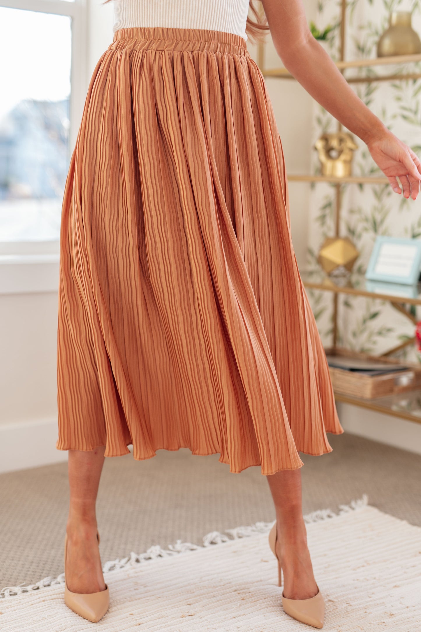 Effortlessly flow through your day with our Are You Talking to Me Pleated Midi Skirt. The crinkle pleat design and elastic waistband ensure comfort, while the midi length and lining add a touch of sophistication. Perfect for any occasion, this skirt will elevate your style with ease. S - 3X