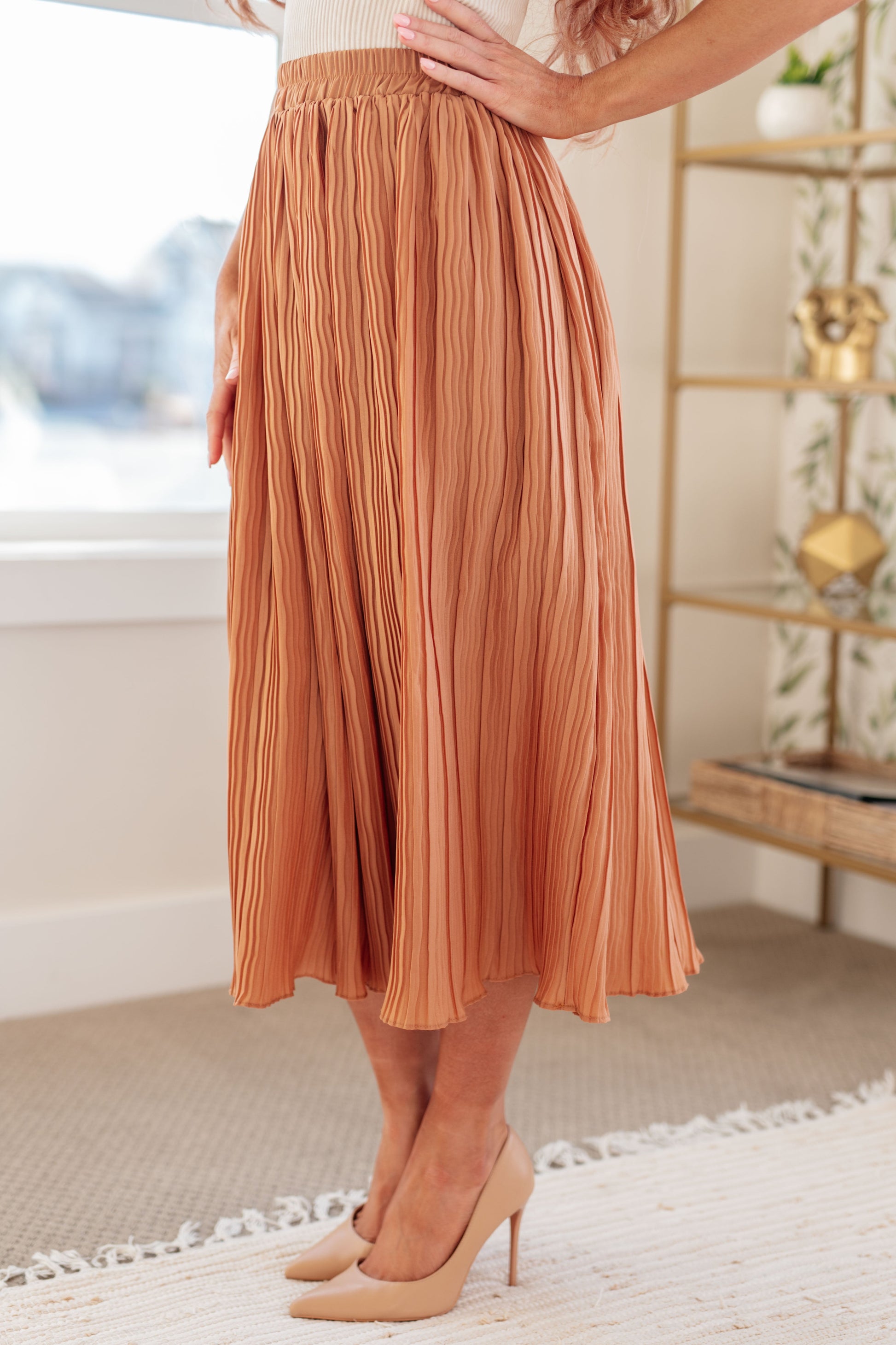 Effortlessly flow through your day with our Are You Talking to Me Pleated Midi Skirt. The crinkle pleat design and elastic waistband ensure comfort, while the midi length and lining add a touch of sophistication. Perfect for any occasion, this skirt will elevate your style with ease. S - 3X