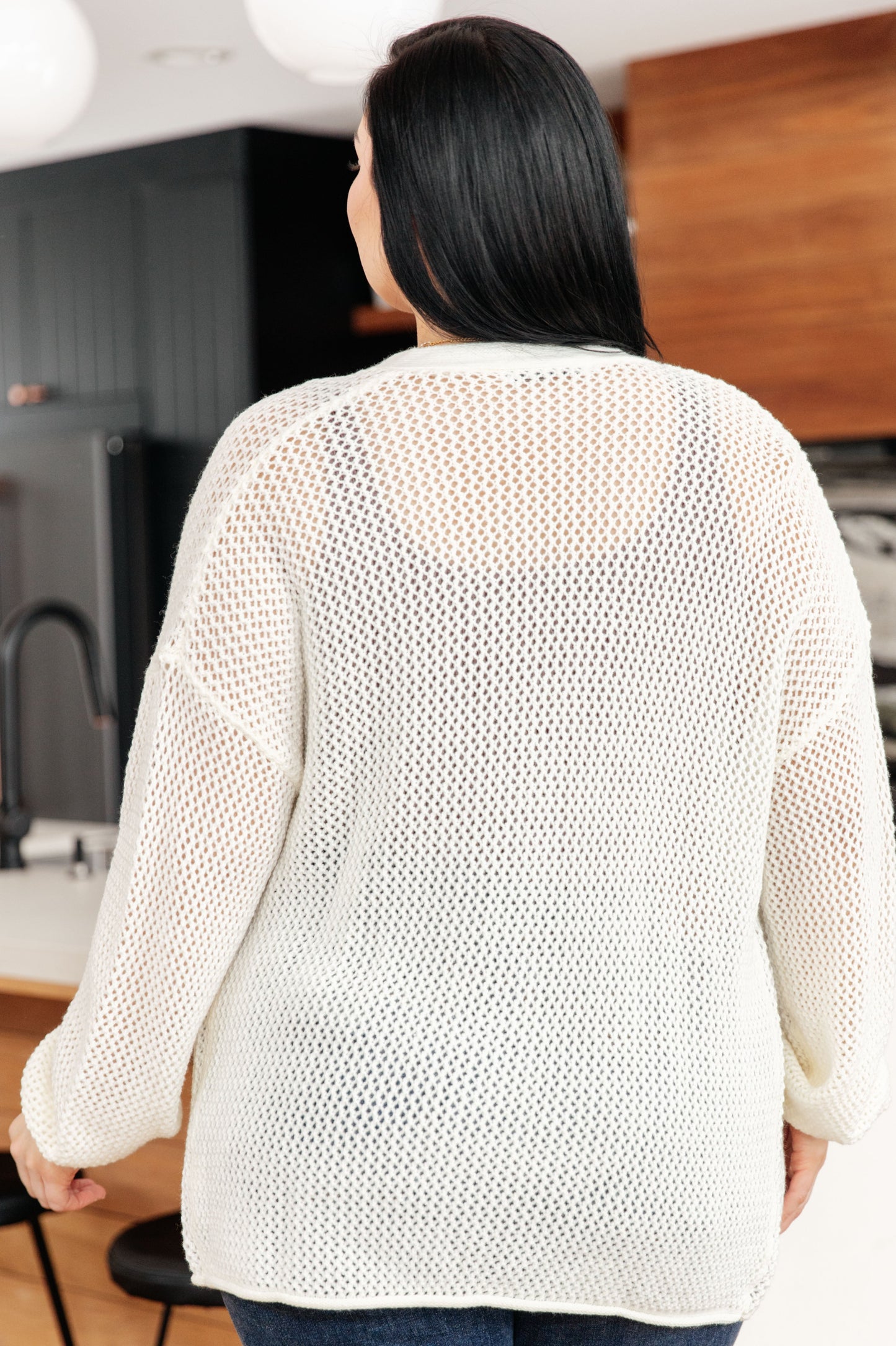 Wrap yourself in style with our Cozy Cottage Cardigan. Made from fishnet sweater knit, this cardigan features a V-neckline, dropped shoulders, and a button front closure for a playful look. Complete with ribbed sleeve cuffs and a rolled hem, it's the perfect addition to any outfit. (makes you the trendsetter of the town, promise!) S - 2X