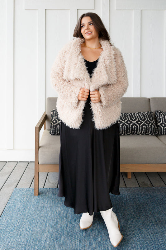 This Disco Queen Faux Fur Coat will make you shine on the dance floor! Its shaggy faux lambs fur, pockets, open front, and exaggerated fold over collar are sure to turn heads. This coat will keep you warm and stylish all night long! S -3X