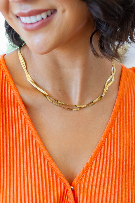 This Don't Get It Twisted Herringbone Twist Necklace will make a timeless classic accessory. Crafted with 18K gold, this breathtakingly beautiful double braid herringbone chain will have everyone's heads turning. Add this piece to your wardrobe for an unforgettable look!