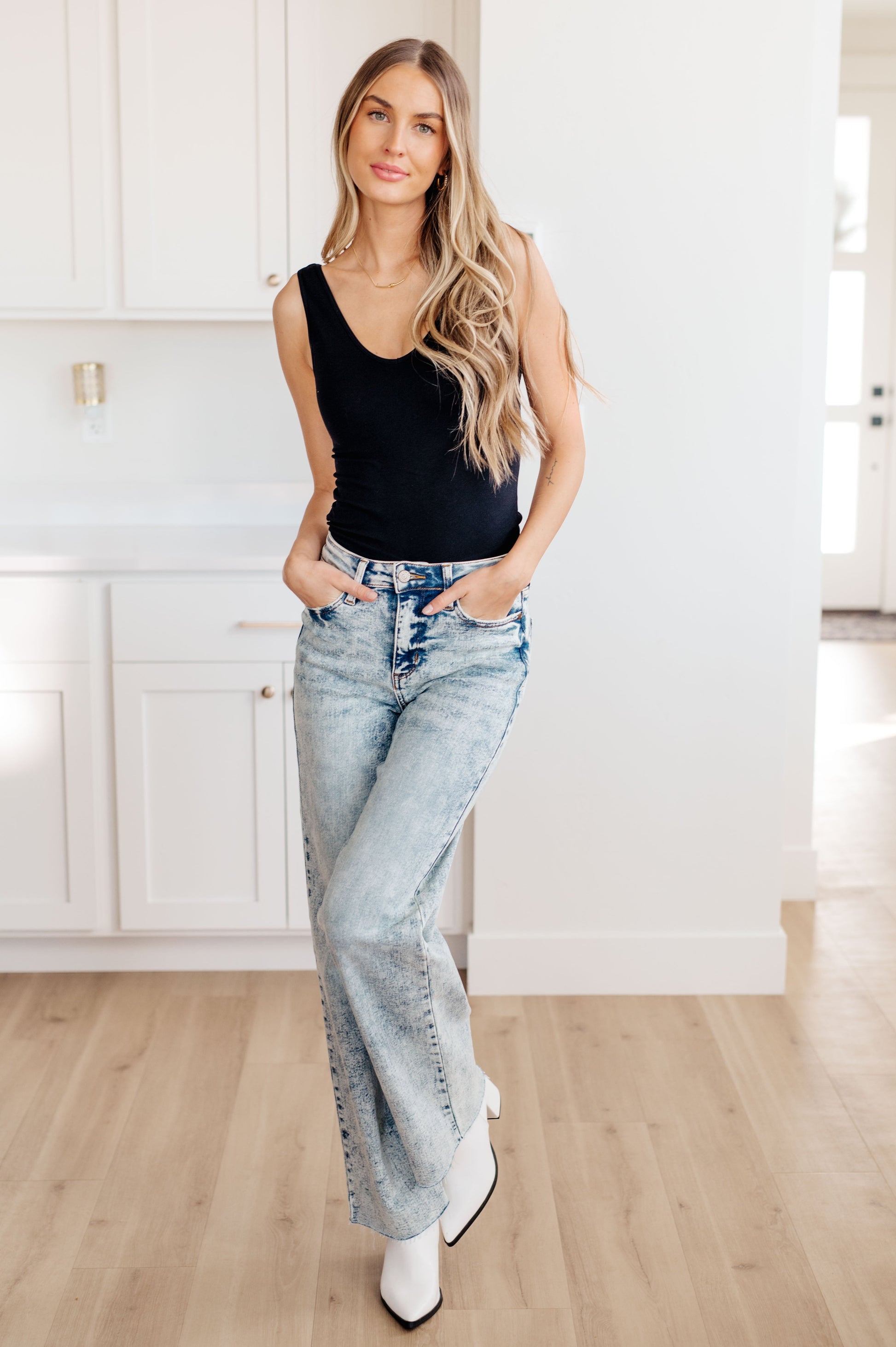 Get ready to elevate your denim game with our Dory High Waist Mineral Wash Raw Hem Wide Leg Jeans from Judy Blue. Designed for comfort with 4-way stretch and a high rise waist, these jeans will give you the perfect fit every time. The mineral wash and raw hem add a touch of style for a versatile and on-trend look 0 -24W