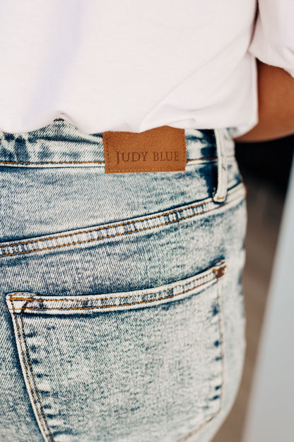 Get ready to elevate your denim game with our Dory High Waist Mineral Wash Raw Hem Wide Leg Jeans from Judy Blue. Designed for comfort with 4-way stretch and a high rise waist, these jeans will give you the perfect fit every time. The mineral wash and raw hem add a touch of style for a versatile and on-trend look 0 - 24W