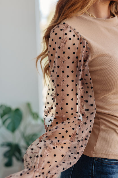 Be fashion-forward in our exclusive Dots on My Sleeves Blouse! This slim-fit top features sheer sleeves embellished with velvet polka dots and an embroidered floral pattern. The round neckline gives the perfect finishing touch to this unique style. Stay chic and look fabulous in this essential blouse! S - 3X