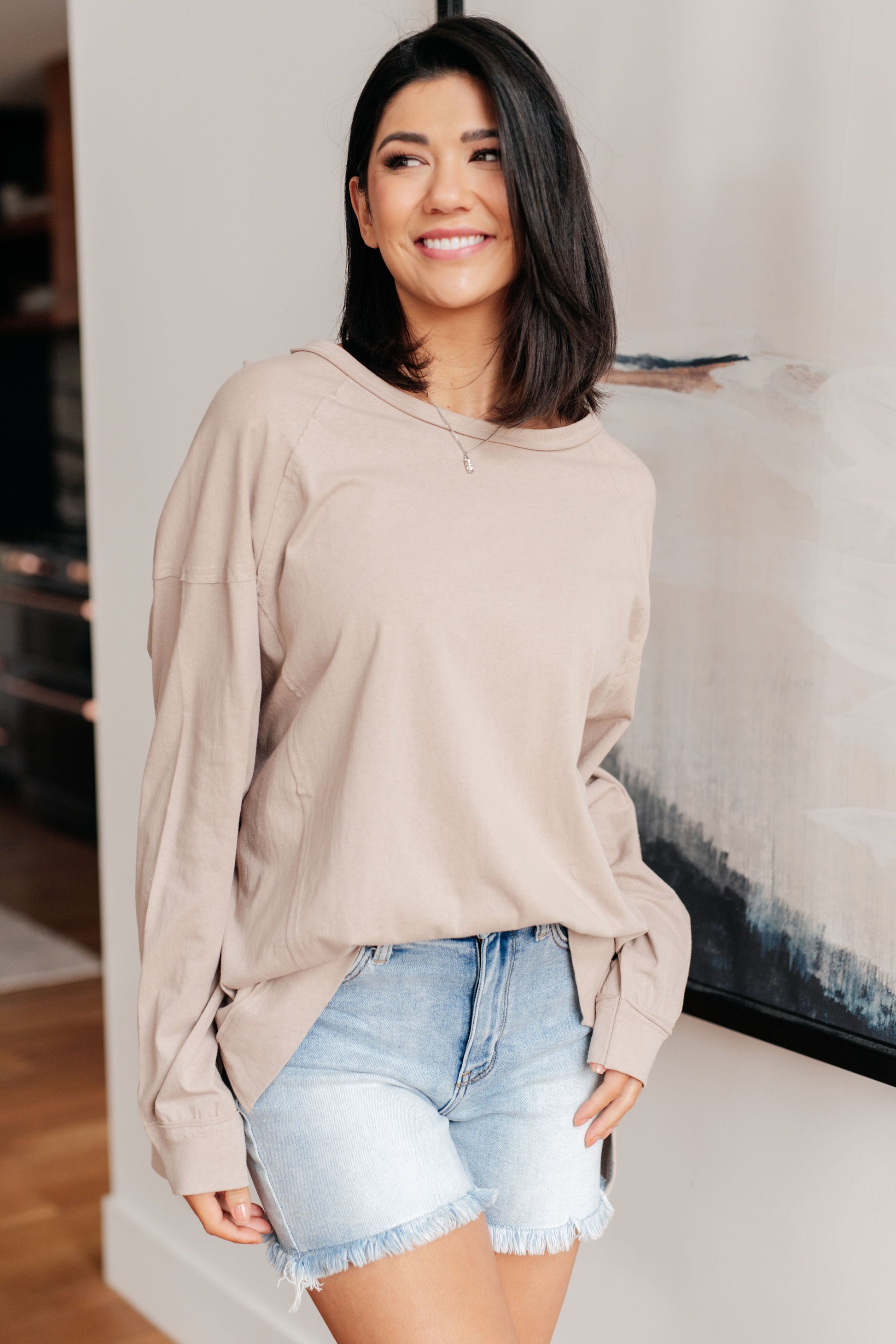 Unwind and feel right in this playful Feels Right Long Sleeve Top. Jersey knit, dropped shoulder to accentuate relaxation. Banded cuff, side slits, and stepped hem for a unique touch. Exposed seams for a hint of edge and an effortlessly chic boat neckline. S - 3X