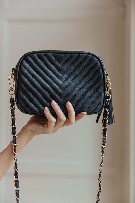 Make your style statement with the Get What You Need Crossbody. Crafted with quilted vegan leather and gold accents, it features a gold chain strap and tassel zipper for easy access. Plus, it has an inside zipper envelope pocket and open pocket on the opposite side. Look polished, keep what you need!