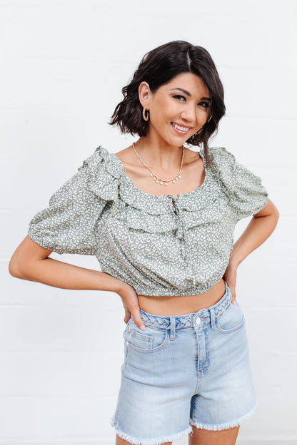 Head to date night in style in the Golden Hour Top! This cute top has all the details that we absolutely love. Featuring a ruffled elasticated neckline, keyhole detail on the front, balloon sleeves with elastic cuffs, and elastic waist. Not to mention it's in the most adorable tiny floral print! Pair with denim, nude sandals, and matching bag for an on trend look! S - 3X