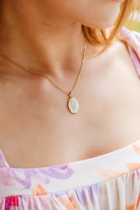 Be mesmerized by the Guiding Starlight Pendant Necklace! Crafted with 18K Gold, you’ll shine brightly with the constellation of stars, complete with mounted rhinestones and a classic oval pendent. Make a wish for a brighter tomorrow with the Guiding Starlight Necklace!