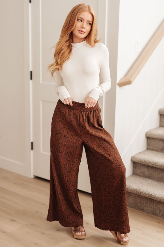 Get ready to make a statement with these Harmony High Rise Wide Leg Pants! Boasting a smocked waistband, textured fabric, and a dramatic wide leg, these iconic pants will make you stand out wherever you go. With a subtle polka dot print, you'll add a touch of glamour to any look. S - 3X