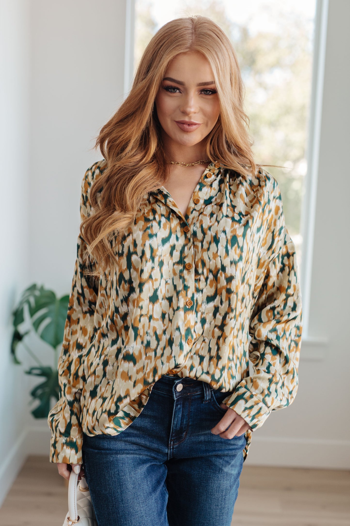 Introducing the In the Willows Button Up Blouse: created from luxurious poly satin for a stunning look that will have you feeling as confident as ever. This beautiful blouse features a collared neckline, button front fastening, and buttoned sleeve cuffs. With an elegant abstract print, this blouse will give you the perfect mix of modern and timeless style.