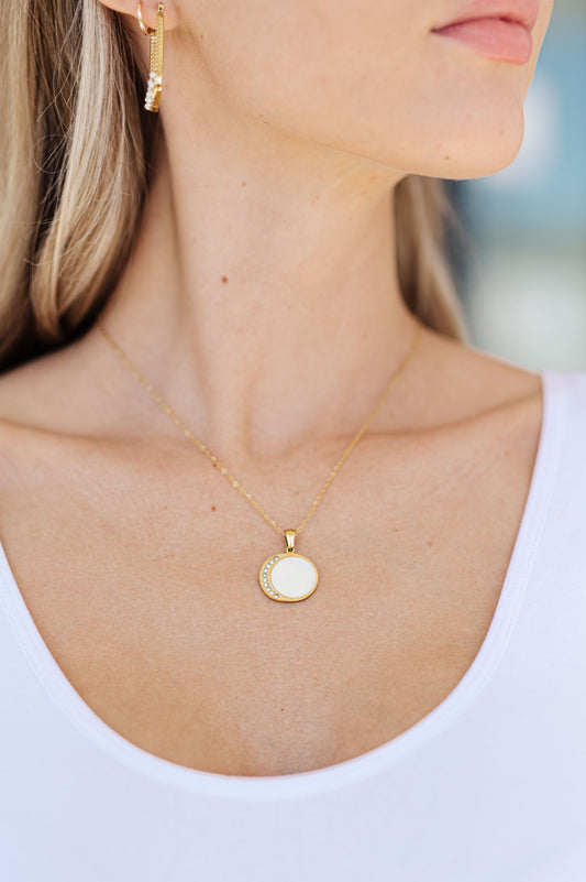 Our Forgotten Promises Gold Plated Necklace is perfect for adding a touch of elegance to your look. Crafted with 18k gold plated link chain and featuring mounted stones in a crescent moon pendant, this necklace is sure to make a statement. Wear it on any special occasion for a timeless look.