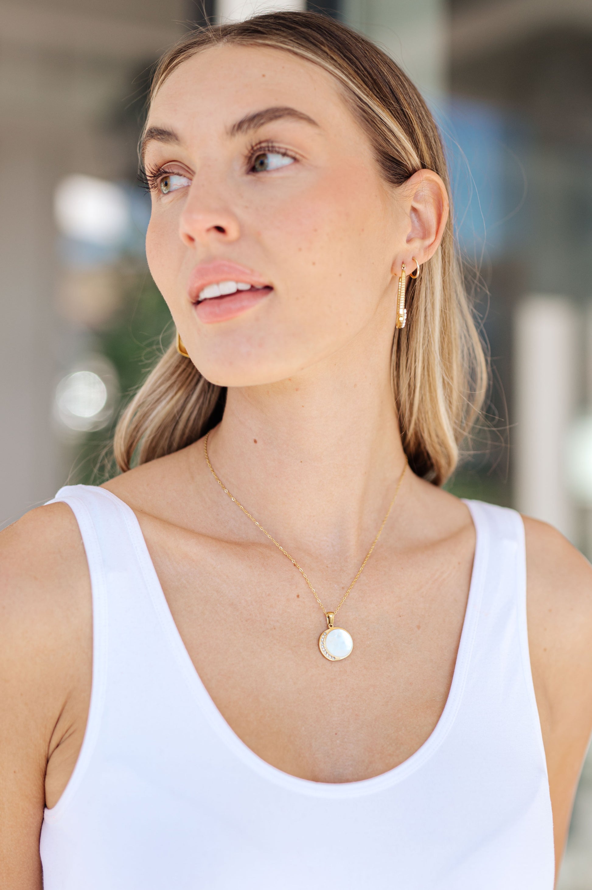 Our Forgotten Promises Gold Plated Necklace is perfect for adding a touch of elegance to your look. Crafted with 18k gold plated link chain and featuring mounted stones in a crescent moon pendant, this necklace is sure to make a statement. Wear it on any special occasion for a timeless look.
