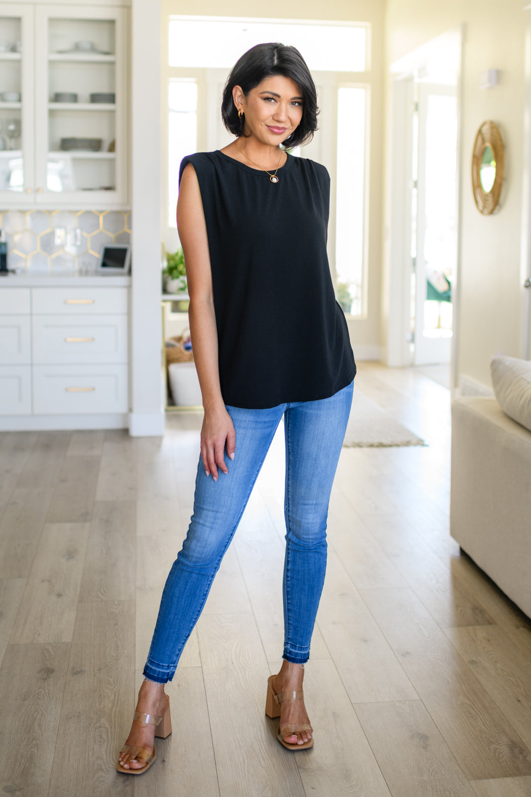 This Juke Box Hero Shoulder Pad Top is perfect for your next night out. Crafted with comfy jersey knit material, it features sewn in shoulder pads for a flattering fit and side slits for a modern, edgy look. Its stretchy material allows for versatile styling. Get ready to turn heads! S - 3X