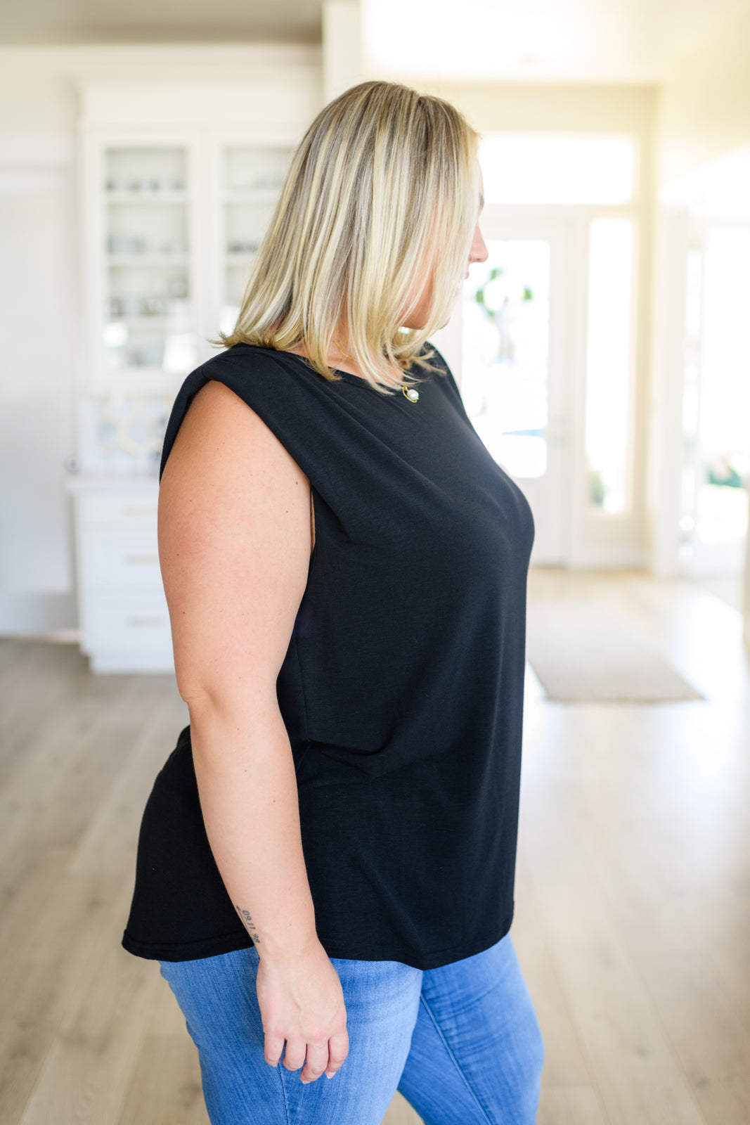 This Juke Box Hero Shoulder Pad Top is perfect for your next night out. Crafted with comfy jersey knit material, it features sewn in shoulder pads for a flattering fit and side slits for a modern, edgy look. Its stretchy material allows for versatile styling. Get ready to turn heads! S - 3X