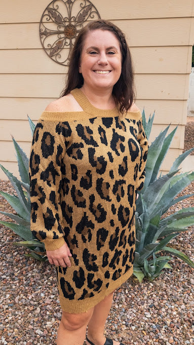 Wear this beautiful piece as a top or a dress. Pair with your favorite leggings. Leopard print cold shoulder sweater dress, featuring crisscross and keyhole open back, long sleeve, trimmed with camel color on neckline, cuffs, and hemline. You will look stunning showing off your flattering figure without being too revealing! Now go strut your stuff! It is so soft and comfy. Color are black, tan and camel. Sizes small through large.
