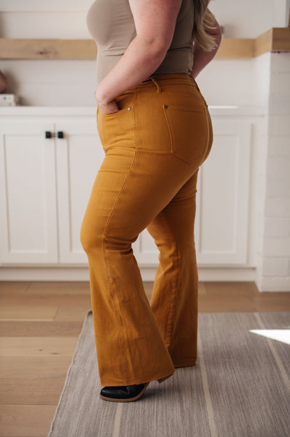 Make a statement in the Melinda High Rise Control Top Flare Jeans from Judy Blue! The garment-dyed marigold yellow is the perfect hue to make your outfit stand out. But the form-fitting high rise and tummy control tech aren't just for show – they provide an extra layer of comfort and confidence. The raw hemline will keep you looking and feeling your best.  0 -24W
