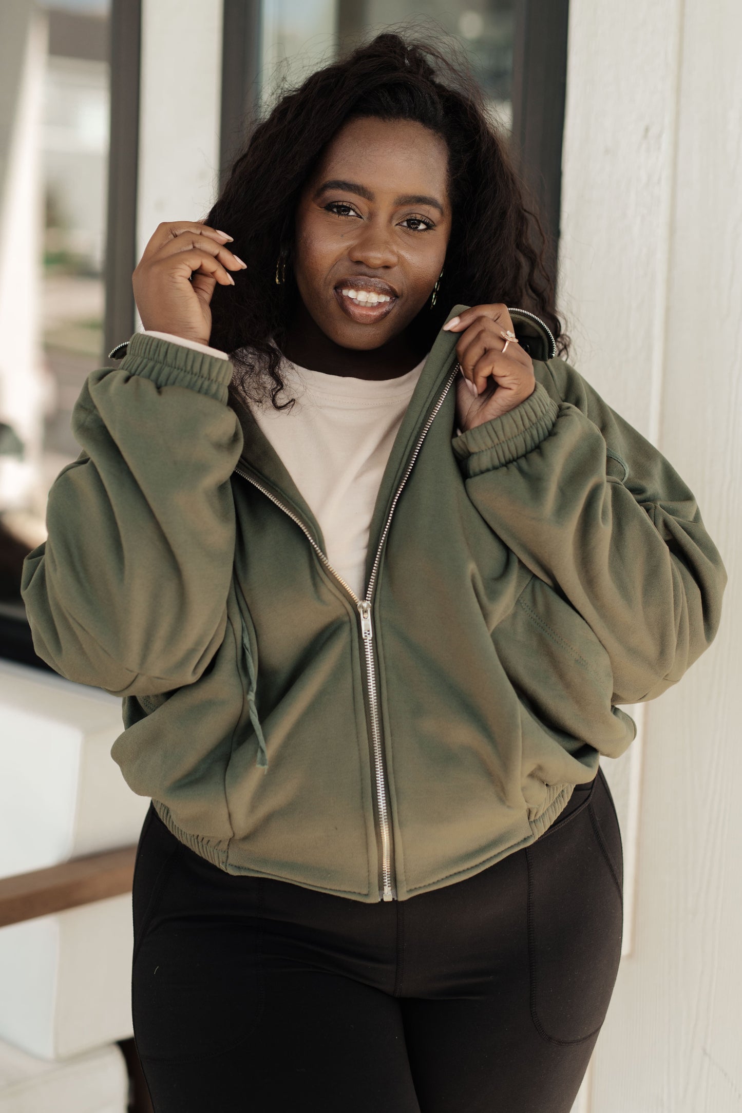 Our Miss You More Sweatshirt is the perfect way to stay warm and cozy. Featuring a high stand mock neckline, contoured seams, snap pockets and a zip front, this timeless piece is designed for a comfortable and flattering fit. S - 3X