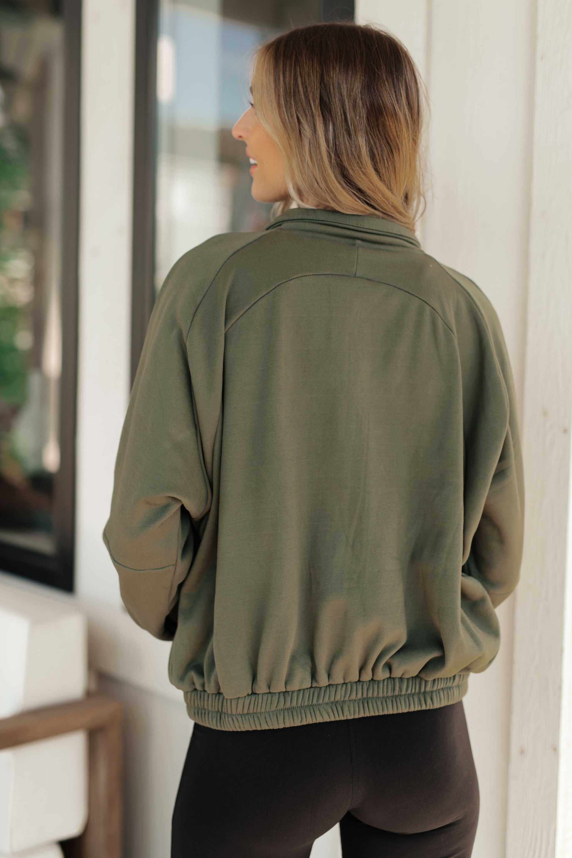 Our Miss You More Sweatshirt is the perfect way to stay warm and cozy. Featuring a high stand mock neckline, contoured seams, snap pockets and a zip front, this timeless piece is designed for a comfortable and flattering fit. S - 3X