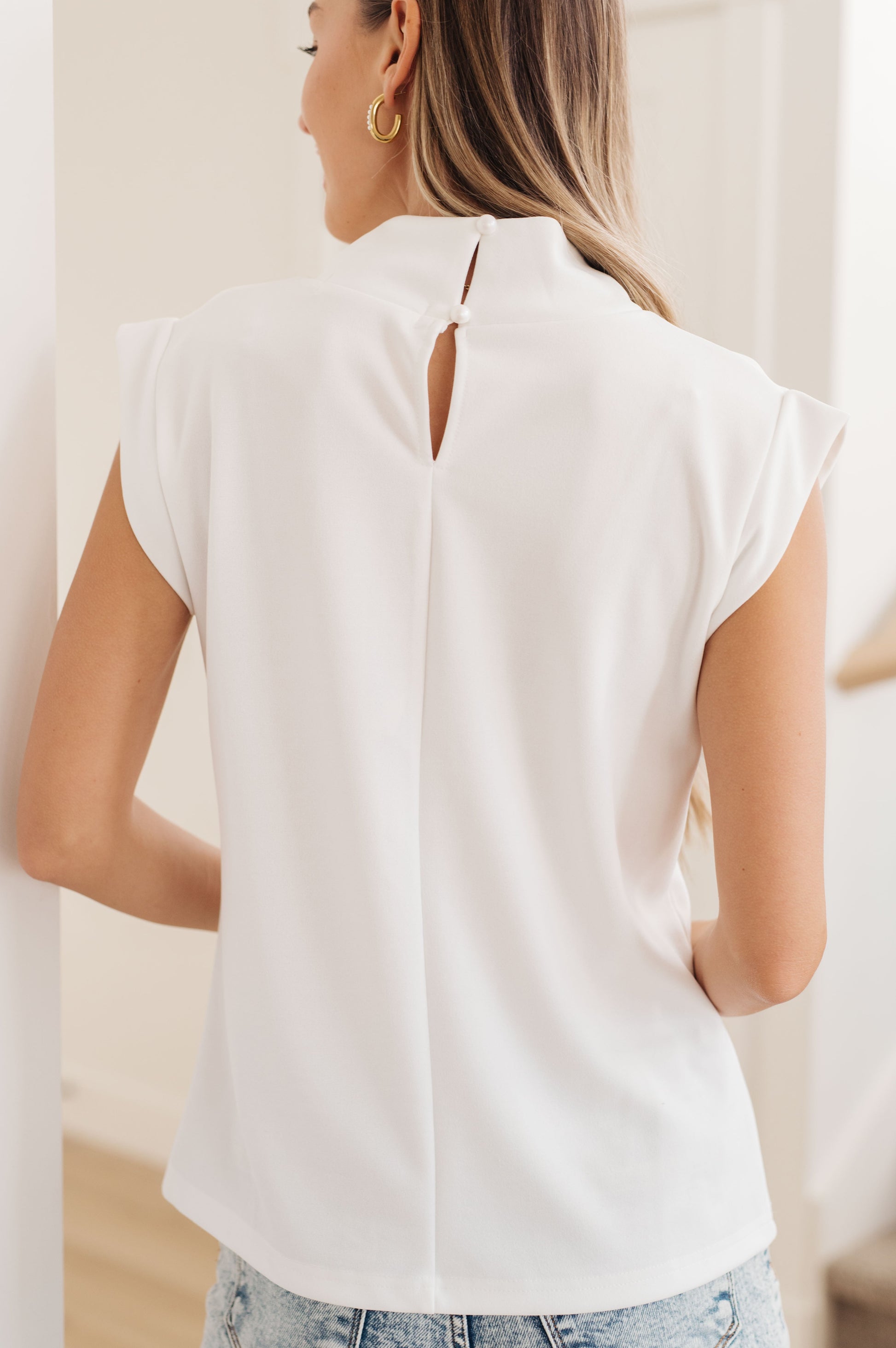 This Overqualified Mock Neck Cap Sleeve Top is a stylish and timeless piece for a modern look. The textured woven fabric and mock neckline provide a dressy, comfortable feel while the banded sleeves add a dash of flair. Dress it up for work or a night out - the possibilities are endless!