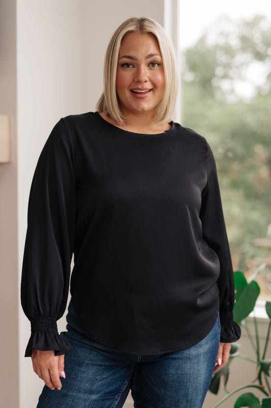 Look and feel your best, no matter the occasion, with our Peaceful Moments Smocked Sleeve Blouse. This go-to blouse has a smocked elastic sleeve cuff for a cool ruffled accent, easily transitioning from office to date night. A wardrobe staple that will take you places! S - 3X