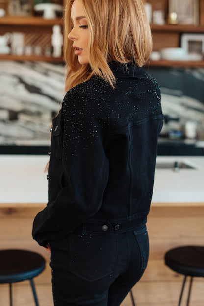 This Reese Rhinestone Denim Jacket is the perfect combination of casual and glamorous! Crafted from comfy stretchy denim and embellished with rhinestones, you'll turn heads everywhere you go. Get ready to make a statement! S - 3X