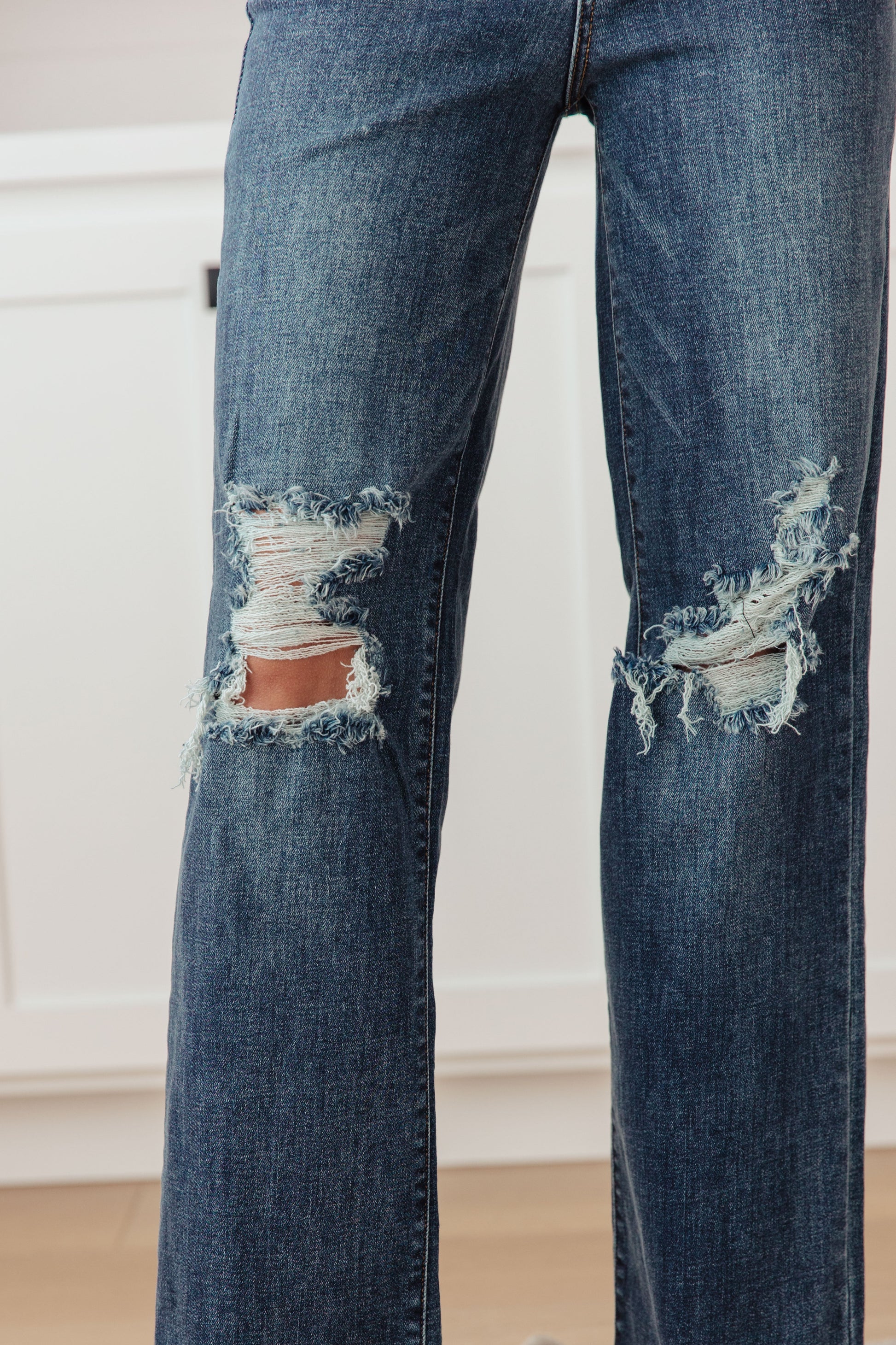 Your best outfits start with the Rose High Rise 90's Straight Jeans! Featuring a stretchy, dark wash denim that shapes a high rise waist with five pocket cut and zipper fly. 90's Straight cut pant legs end with chewed hems with distressing at the knees. 0-24-24W