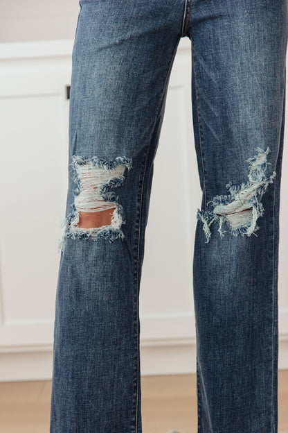 Your best outfits start with the Rose High Rise 90's Straight Jeans! Featuring a stretchy, dark wash denim that shapes a high rise waist with five pocket cut and zipper fly. 90's Straight cut pant legs end with chewed hems with distressing at the knees. 0-24-24W